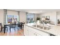 Modern kitchen with granite countertops, stainless steel appliances, an island and views of the water at 211 Calm Dr., Little River, SC 29566