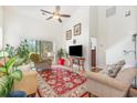 Bright living room with vaulted ceilings, a ceiling fan, and a sliding glass door leading to the exterior at 223 Connemara Dr. # A, Myrtle Beach, SC 29579