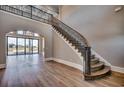 Spacious foyer features a grand staircase, hardwood floors, and high ceilings with lots of natural light at 2417 Gist Ln., Myrtle Beach, SC 29588