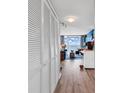 Hallway featuring a large closet leading into a brightly lit living room with ocean views at 2501 South Ocean Blvd. # 1011, Myrtle Beach, SC 29577