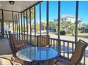 Relaxing screened porch with comfortable seating and neighborhood view at 312 Norris Dr., Pawleys Island, SC 29585