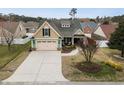 Aerial view of a lovely home, showcasing its well-kept lawn and neighborhood at 4228 Ravenwood Dr., Little River, SC 29566