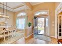 Inviting foyer with hardwood floors, arched doorways, and natural light. Features a view into dining area at 432 Highfield Loop, Myrtle Beach, SC 29579