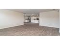 Open-concept living space flows into a kitchen with stainless steel appliances, perfect for entertaining at 4480 East Coast Ln., Shallotte, NC 28470