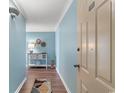 Hallway with blue walls and decor at 501 S Ocean Blvd. # 1006, North Myrtle Beach, SC 29582