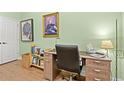 Bright office space with a large desk, storage, and pleasant green walls at 570 Botany Loop Murrells Inlet # 570, Murrells Inlet, SC 29576