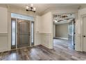 Inviting foyer featuring hardwood-style tile flooring and an open doorway to another room at 6013 Blease Ct., Myrtle Beach, SC 29588