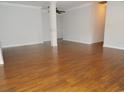 Spacious room with hardwood floors, neutral walls, and abundant natural light at 6654 Wisteria Dr., Myrtle Beach, SC 29588