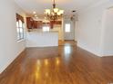 Open floor plan featuring a kitchen view, hardwood flooring, and ample natural light at 6654 Wisteria Dr., Myrtle Beach, SC 29588