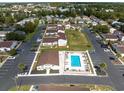 Birds-eye view of condo community with pool, manicured lawns, parking, and other community buildings at 800 9Th Ave. S # T3, North Myrtle Beach, SC 29582
