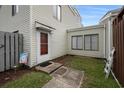 Well-maintained condo entrance with landscaped garden, secure door and walkway at 800 9Th Ave. S # T3, North Myrtle Beach, SC 29582
