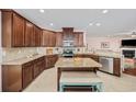 Spacious kitchen featuring granite countertops, stainless steel appliances, a kitchen island, and ample cabinetry at 1112 Raven Cliff Ct., Conway, SC 29526