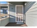 The front door features a white screen door and is labeled C303 at 1101 Possum Trot Rd. # C-303, North Myrtle Beach, SC 29582