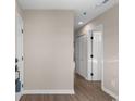 Hallway featuring neutral walls and wood-look flooring at 1101 Possum Trot Rd. # C-303, North Myrtle Beach, SC 29582