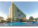 Enjoy the expansive outdoor pool and lounging area at Coral Beach Resort at 1105 S Ocean Blvd. # 1224, Myrtle Beach, SC 29577