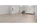 Spacious living area with light-colored floors, neutral walls, and abundant natural light at 1136 Knotty Branch Rd., Conway, SC 29527
