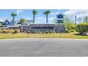 Community entrance featuring a Harborview stone sign, landscaping and palm trees at 1279 Safe Haven Dr., Myrtle Beach, SC 29579