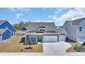 Beautifully designed home with a two-car garage and landscaped front yard at 1279 Safe Haven Dr., Myrtle Beach, SC 29579
