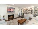 Cozy living room featuring a fireplace, built-in bookshelves, and a comfortable seating area at 135 Chapel Creek Rd. # 41, Pawleys Island, SC 29585