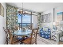 Cozy dining area features ocean views, nautical decor, and stylish furnishings at 1501 S Ocean Blvd. # 1042, Myrtle Beach, SC 29577