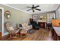 Cozy living room with beautiful hardwood floors, a ceiling fan, and ample seating at 1502 Mckeithan St., Conway, SC 29526