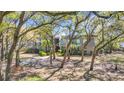 Charming condo surrounded by mature trees, enhancing the natural beauty at 178 Salt Marsh Circle # 30D, Pawleys Island, SC 29585