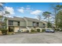 Exterior view of townhouses with balconies and landscaping at 25 Gate 1 # 25, Carolina Shores, NC 28467