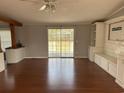 Open-concept room with sliding glass door and custom built-ins at 301 Byrnes Circle, Johnsonville, SC 29555