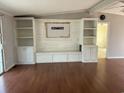 Bright living room featuring custom shelving and a built-in bench at 301 Byrnes Circle, Johnsonville, SC 29555
