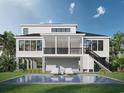 Luxurious backyard featuring a screened porch, a sparkling pool, and comfortable lounge seating at 318 15Th Ave. S, Surfside Beach, SC 29575