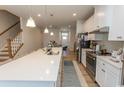 Modern kitchen featuring an island with a sink, stainless steel appliances, white cabinets, and open floor plan at 341 Golan Circle # B, Myrtle Beach, SC 29579