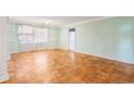 Bright and airy living room featuring parquet floors and soft green walls at 3494 Cactus St. # 3494, Myrtle Beach, SC 29577