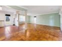 Open living area with hardwood floors, columns, and a view to the outdoors at 3494 Cactus St. # 3494, Myrtle Beach, SC 29577