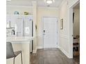 Entryway featuring light wood floors and view of open kitchen at 4155 Hibiscus Dr. # 204, Little River, SC 29566