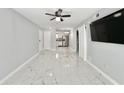 Bright and spacious living room with marble floors and a modern ceiling fan at 515 37Th Ave. N # 101, Myrtle Beach, SC 29572