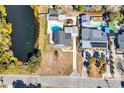 Birds eye view of the backyard featuring a swimming pool, back porch, and an adjacent pond at 806 Duncan Ave., Myrtle Beach, SC 29572