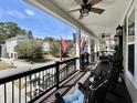 Relaxing front porch with rocking chairs, ceiling fans, and neighborhood views at 817 Falkirk St., Myrtle Beach, SC 29579