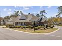 Beautifully landscaped corner lot featuring a well-maintained home with brick and siding exterior at 820 Morrall Dr., North Myrtle Beach, SC 29582