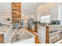 Modern kitchen featuring granite countertops, stainless steel appliances, and stylish wood accents at 9648 Bradford Ln., Murrells Inlet, SC 29576