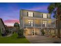 Stunning elevated beach house featuring ample parking, outdoor living spaces, and close proximity to the beach at 213 S Myrtle Dr., Surfside Beach, SC 29575