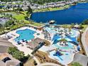 Aerial view of a resort-style pool area with multiple pools, water slides, and lounge chairs at 324 Highfield Loop, Myrtle Beach, SC 29579