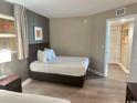 Comfortable bedroom showcasing a relaxing space with neutral tones and a closet at 3500 N Ocean Blvd. # 1203, North Myrtle Beach, SC 29582