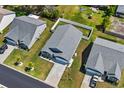 Aerial view of a charming single-story home with a gray roof, well-manicured lawn, and white fenced backyard at 361 Rycola Circle, Myrtle Beach, SC 29575