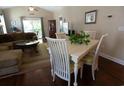 Bright dining area featuring hardwood floors and a table with seating for four near the living room at 408 7Th Ave. S, North Myrtle Beach, SC 29582