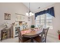 Charming dining room featuring a wooden table, stylish chairs, and a decorative chandelier at 542 Sand Ridge Rd., Conway, SC 29526