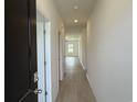 Bright hallway with neutral walls and hardwood flooring at 1025 Jase Dr., Longs, SC 29568