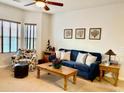 Inviting living room features a comfortable blue sofa, accent chair, and natural light at 4603 Arran Ct. # C, Myrtle Beach, SC 29579