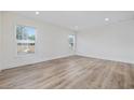 Spacious bedroom with two windows and modern flooring at 1236 Heritage Rd., Loris, SC 29569