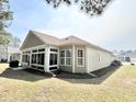 This lovely home boasts a bright sunroom addition and well-kept backyard landscaping at 1652 Murrell Pl., Murrells Inlet, SC 29576