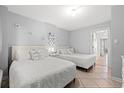 Bright bedroom featuring two beds with white bedding, tile flooring, and beach themed decorations at 2001 S Ocean Blvd. # 720, Myrtle Beach, SC 29577